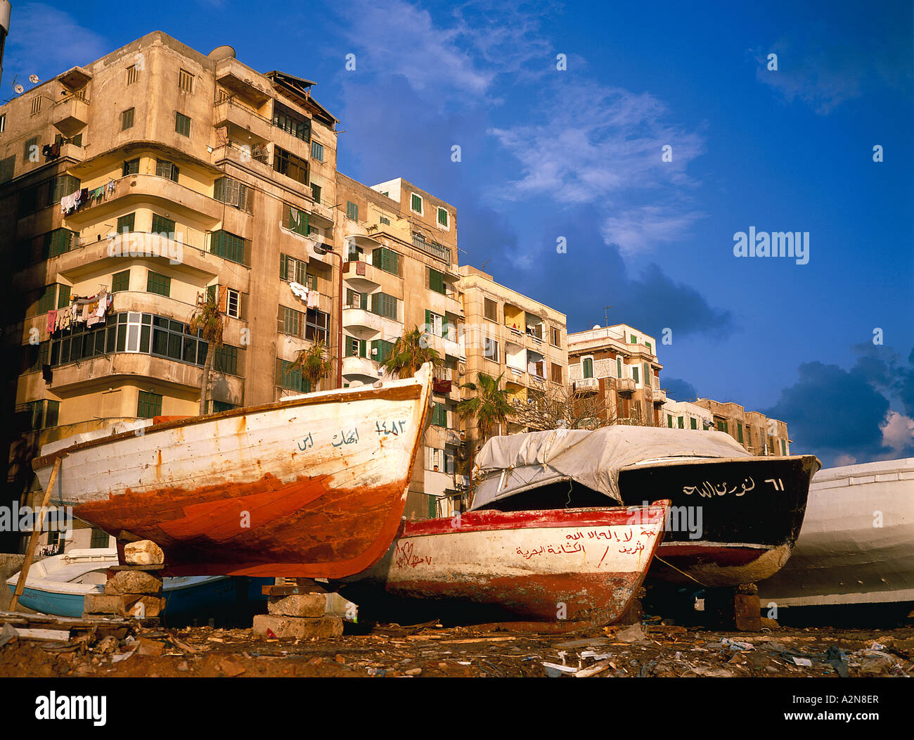 Boats in front of apartment buildings, Alexandria, Egypt Stock Photo