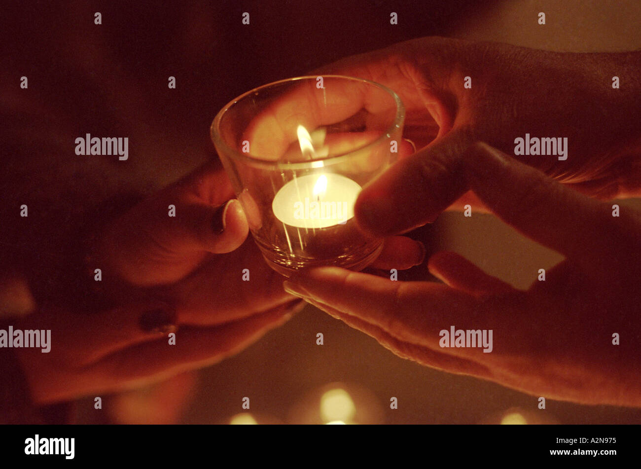 Holds two candles hires stock photography and images Alamy