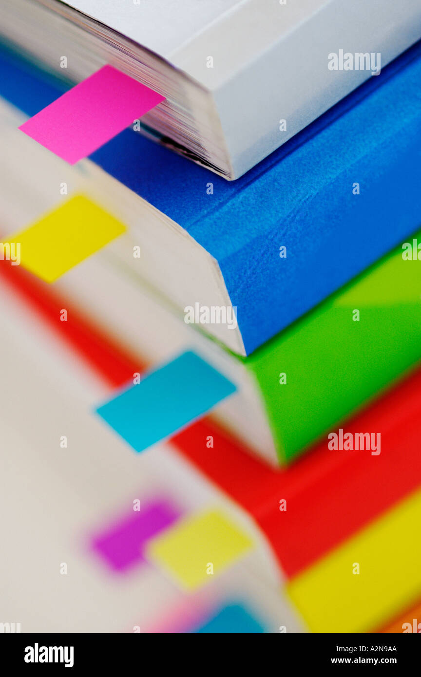BOOKMARKS POST IT NOTES IN BOOK Stock Photo