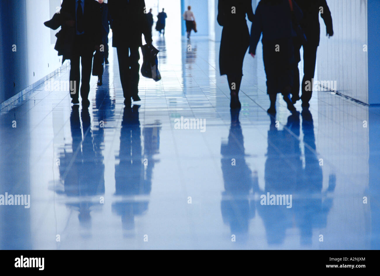 Low section view of businesspeople walking in corridor Stock Photo