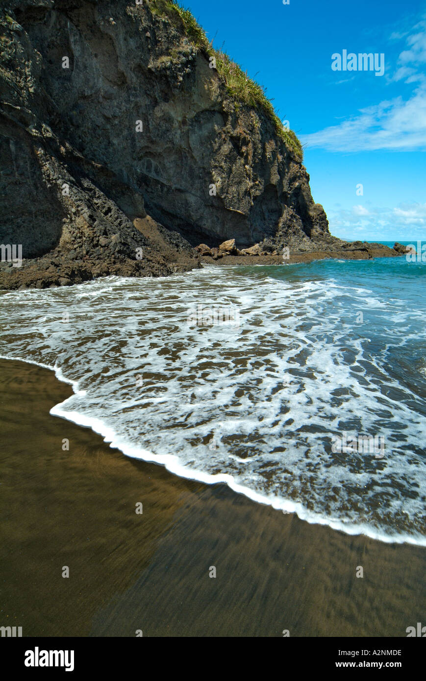Black volcanic sand on a beach Manukau Heads Manukau Harbour Auckland