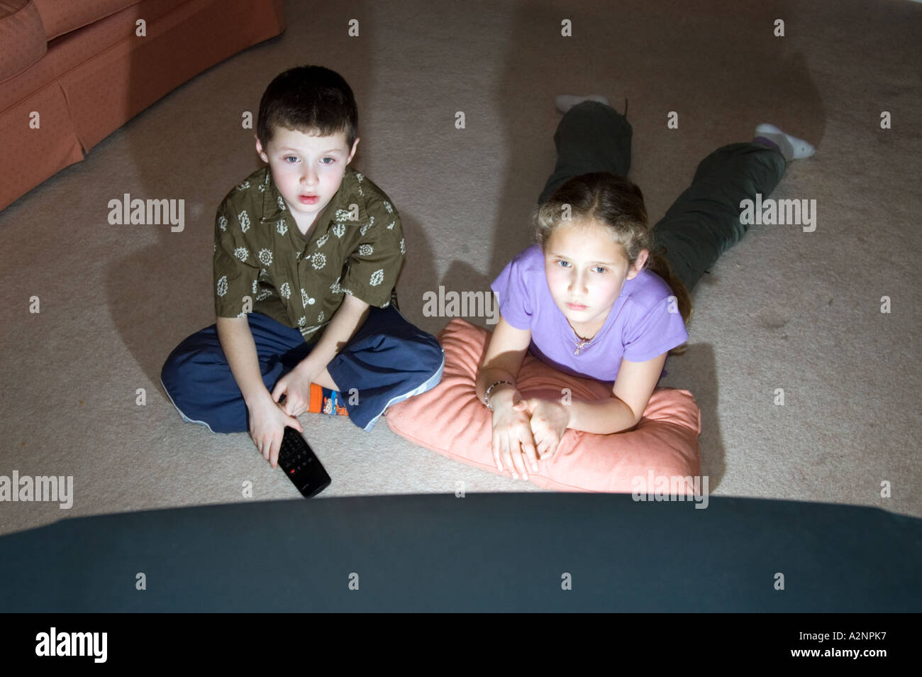 Children watching television at home England UK Stock Photo
