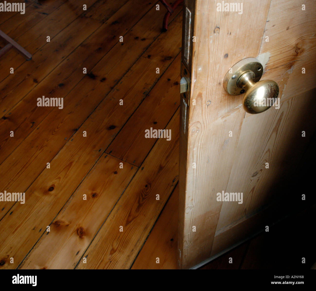 Brass Door Handle On Pine Wood Door With Varnished Pine Wooden