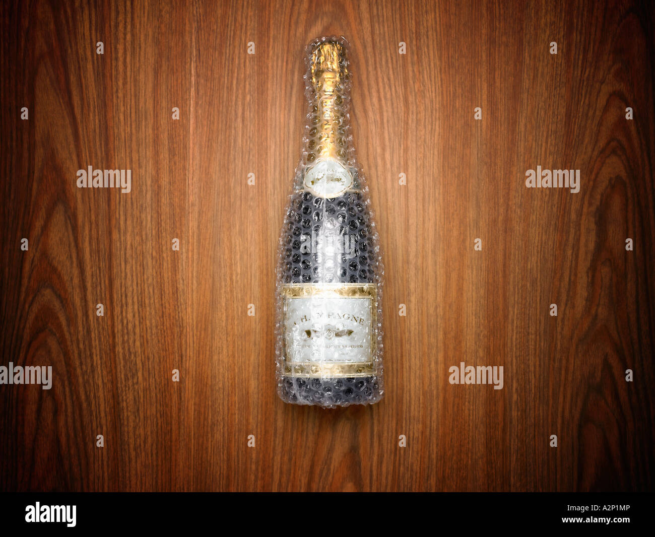 Champagne bottle wrapped in bubble wrap Stock Photo Alamy