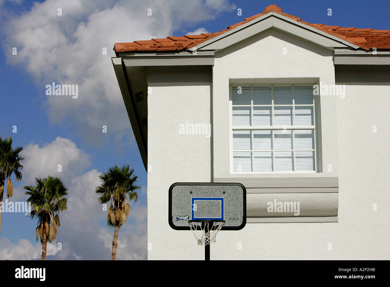 basketball net hoop infront of house play siding back stop backstop