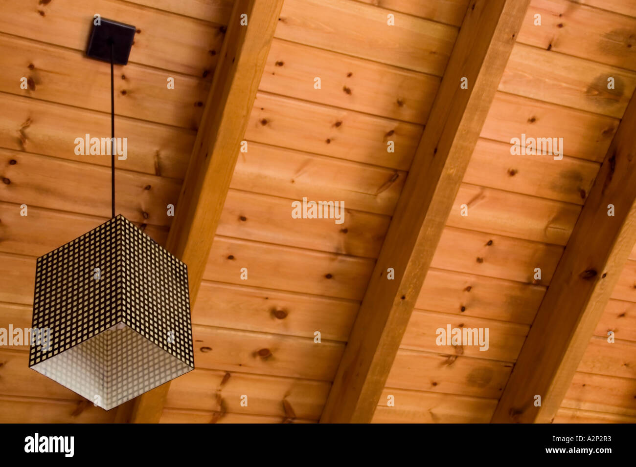 Stock Photo Of A Lamp Hanging From A Pinewood Ceiling Stock Photo