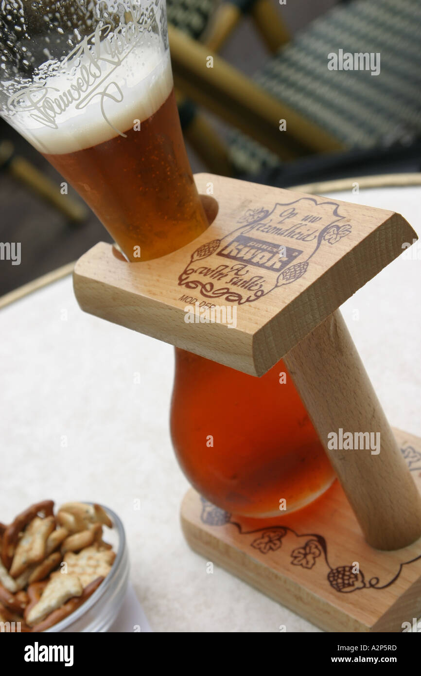 A traditional Kwak Belgian beer with pretzels at a bar in Belgium Stock
