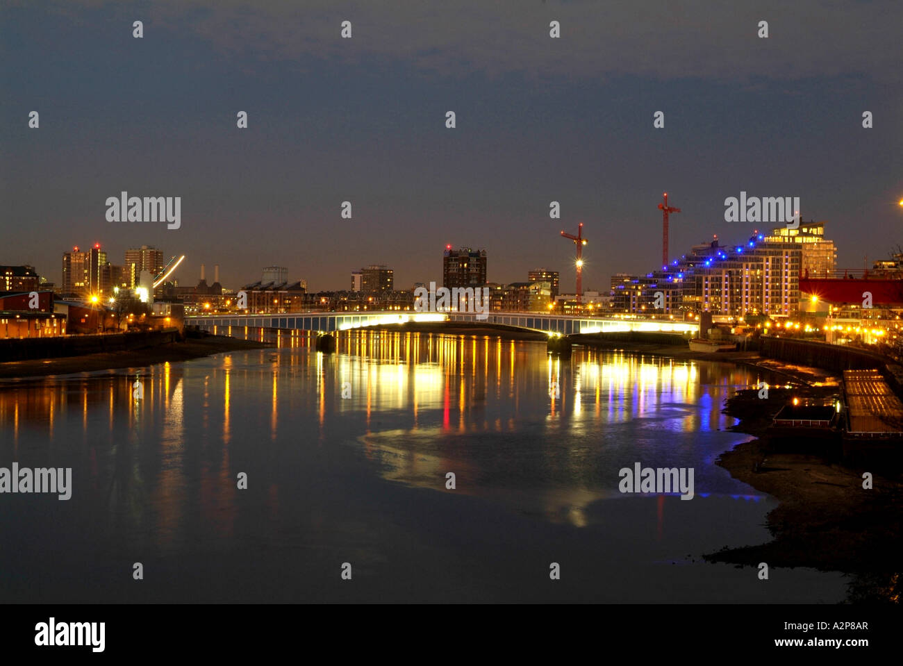 River Thames at night, looking down river, to Wandsworth Bridge, London England Stock Photo