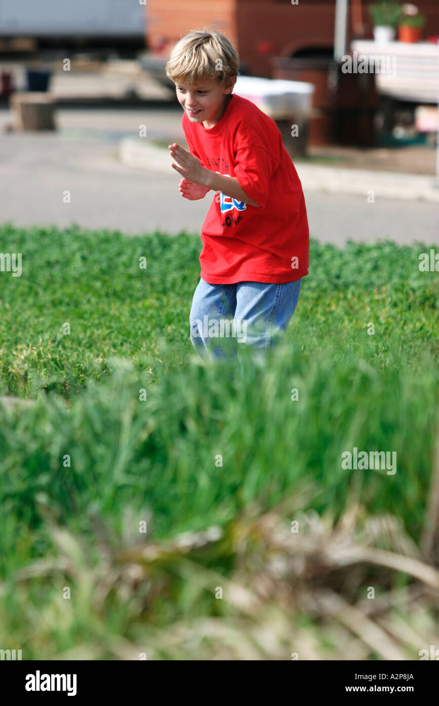 A young boy plays at the park. Stock Photo