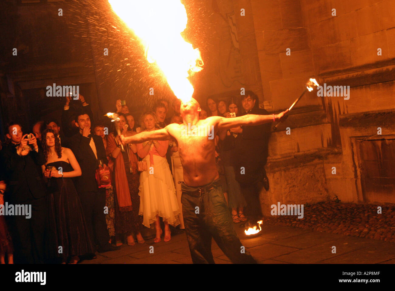 Fire breather entertains students Oxford University Ball Stock Photo