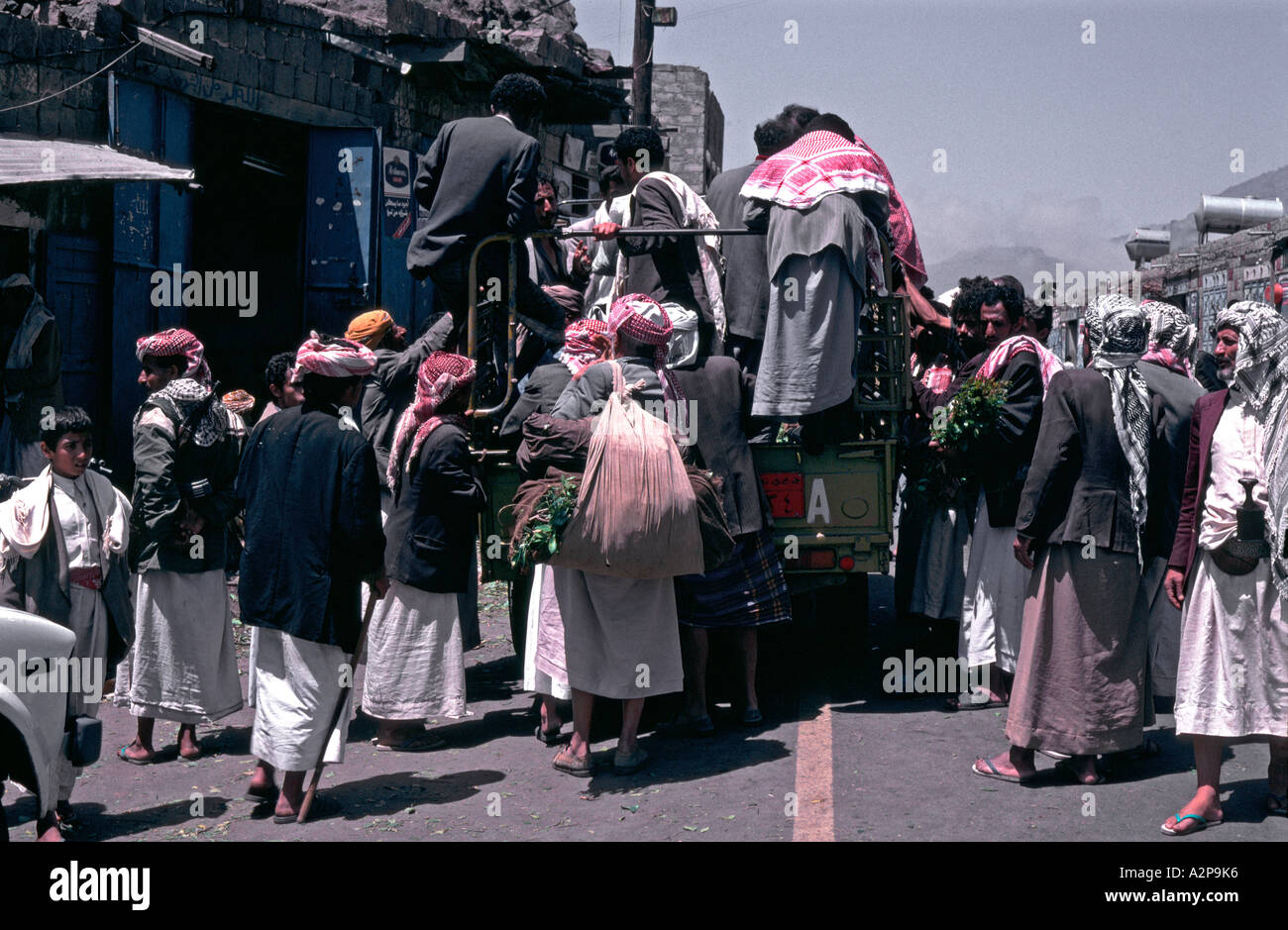 Yemen men buying their afternoon supply of qat from lorry Stock Photo
