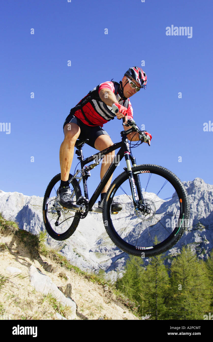 mountainbiker springing Stock Photo
