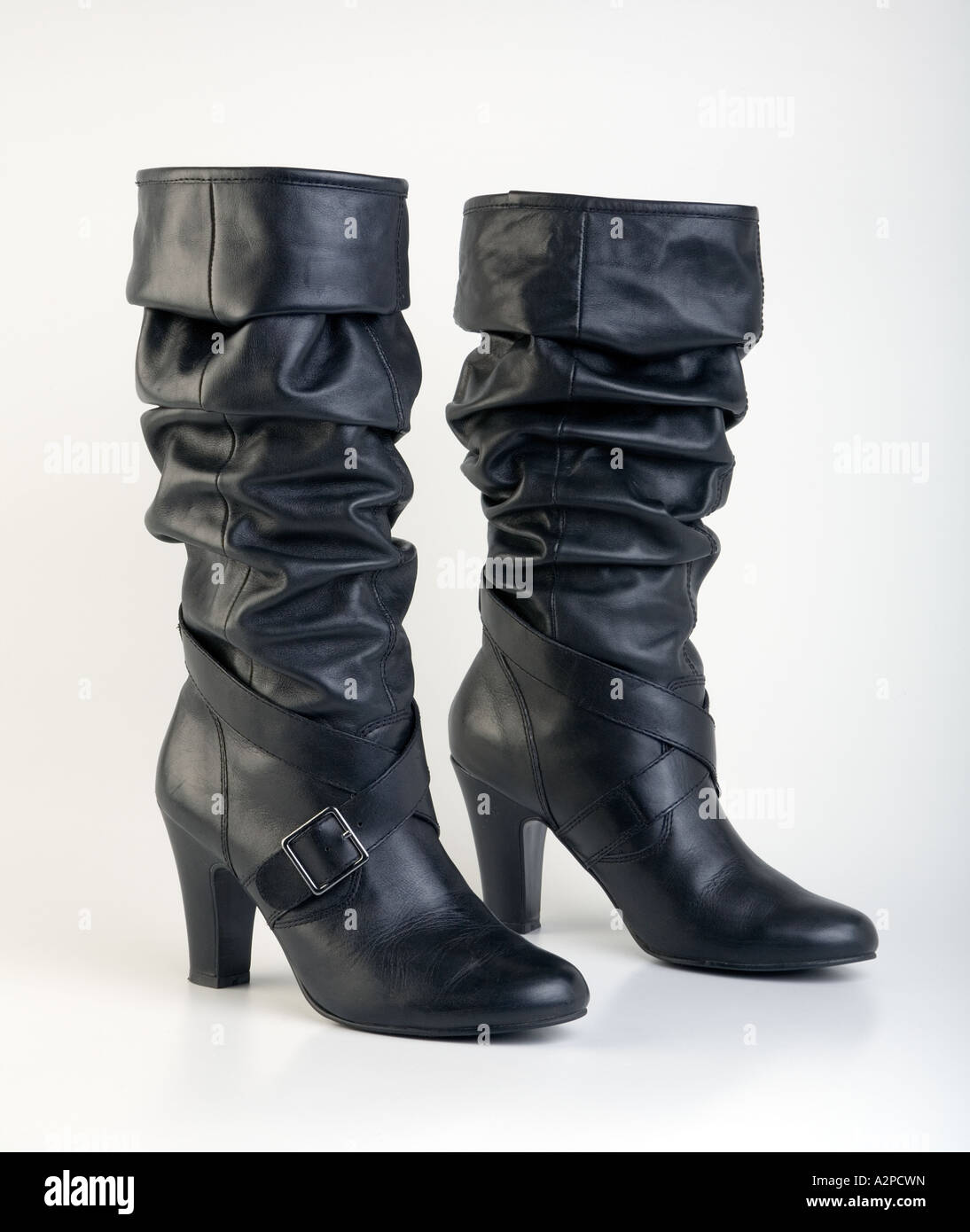 Black knee length fashionable leather ladies boot Stock Photo