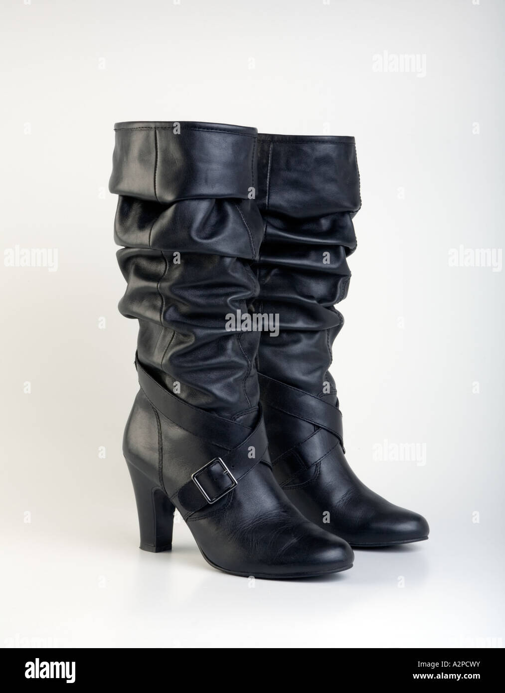 Black knee length fashionable leather ladies boot Stock Photo