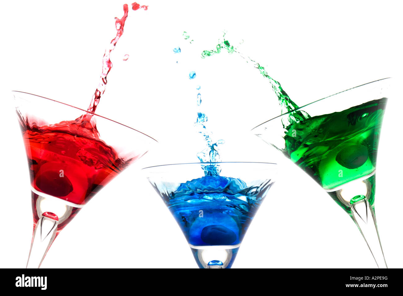 coloured cocktails with olive splash Stock Photo Alamy