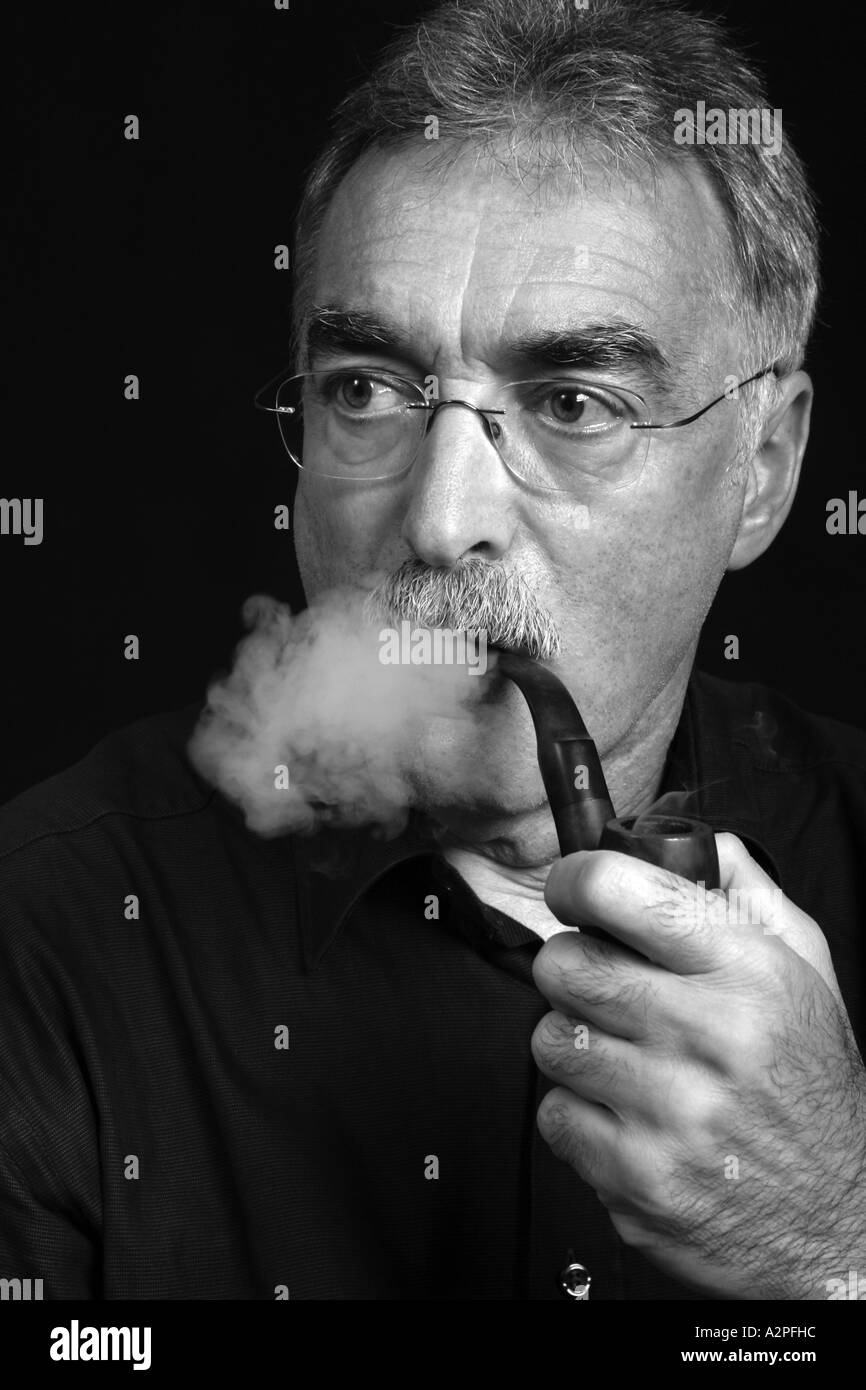 old man smoking pipe Stock Photo