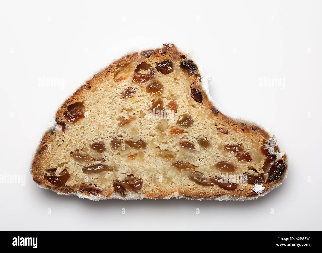 Slice of a traditional german christmas stollen, dry fruit cake Stock Photo