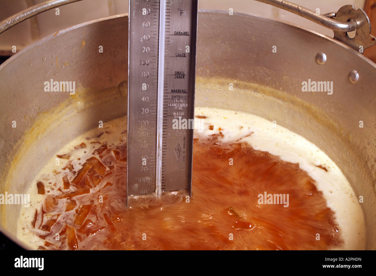 Marmalade boiling in a preserving pan Temperature control Stock Photo