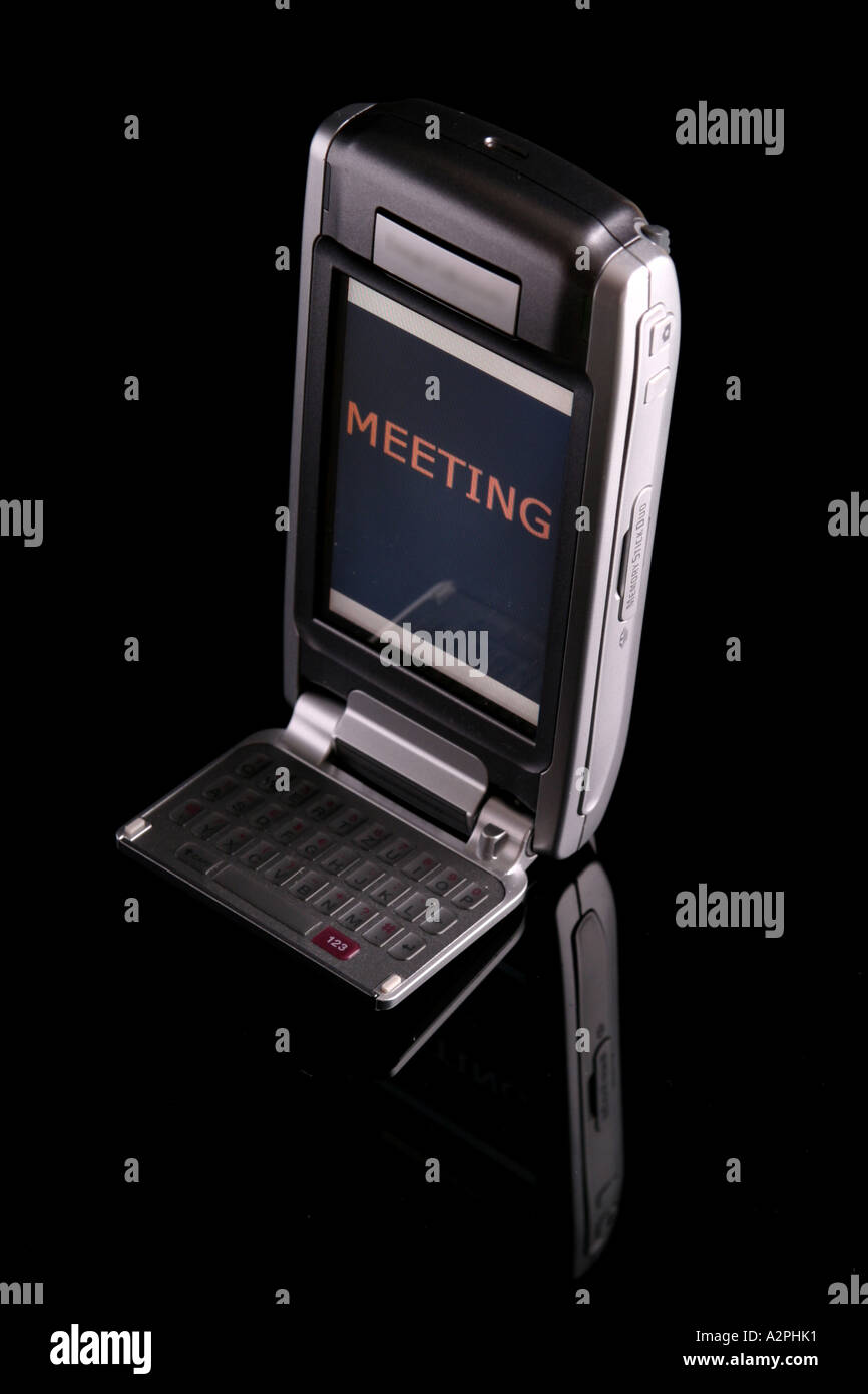 mobile phone / PDA / meeting Stock Photo Alamy