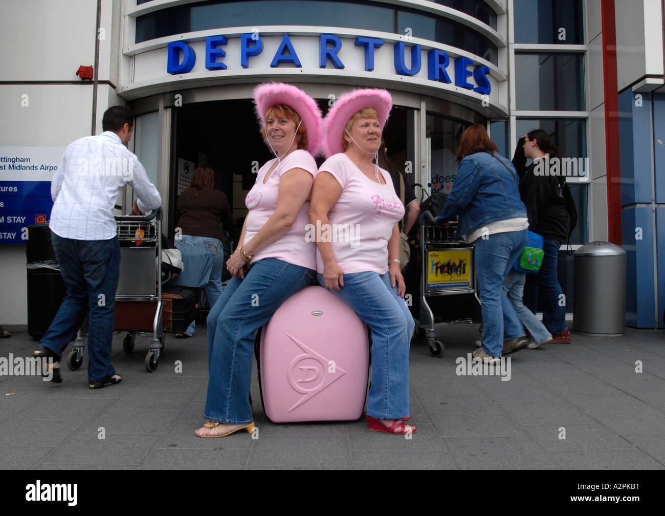 Passengers waiting outside the departures terminal at East Midlands