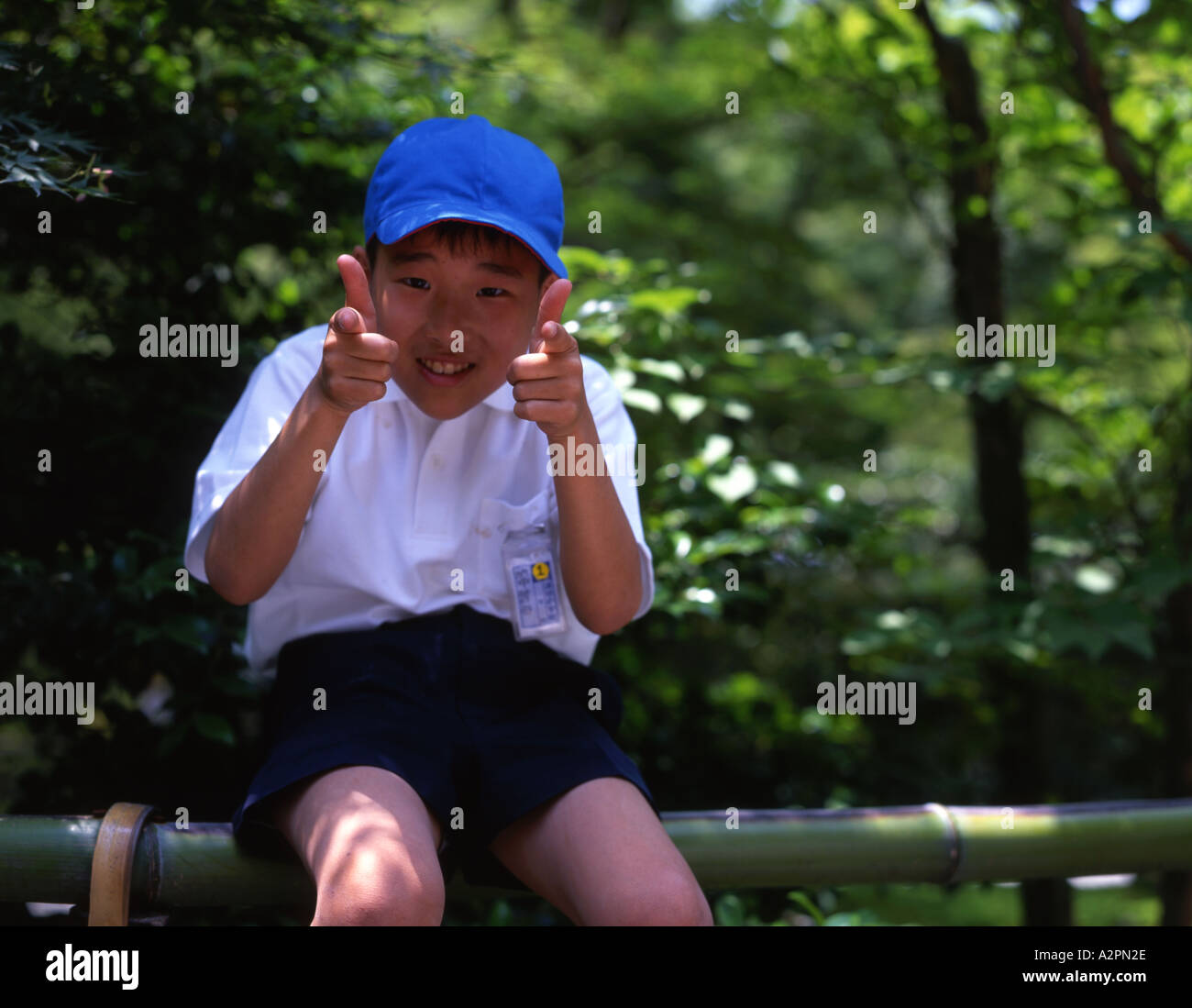Japanese Elementary School boy visiting Kinkakuji temple Stock Photo