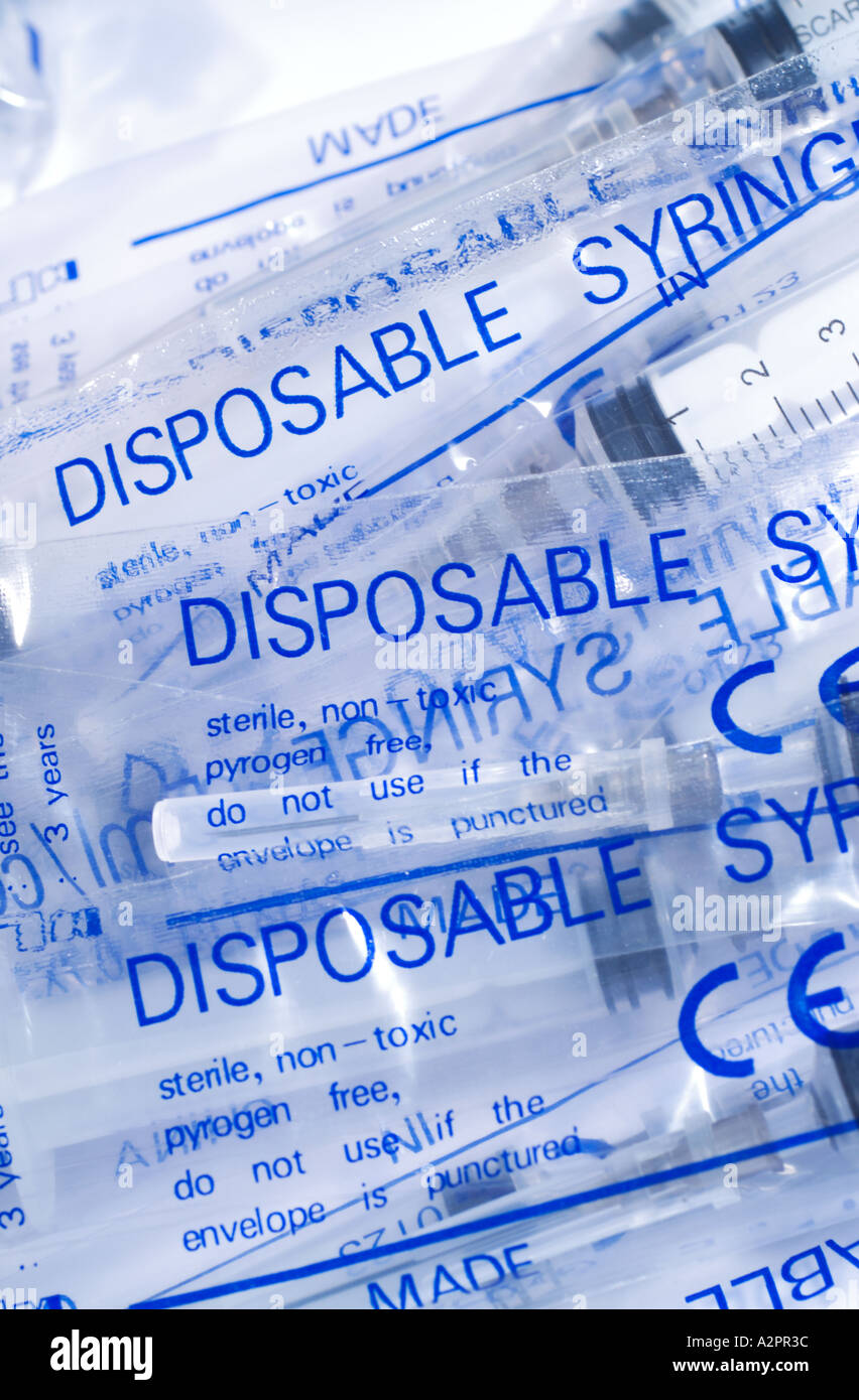 Disposable hypodermic syringes in packaging Stock Photo Alamy