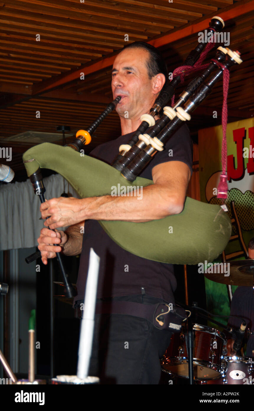Israel Ginosar bagpipes on stage Traditional Irish folk music at the Jacob s Ladder Festival December 2006 Stock Photo