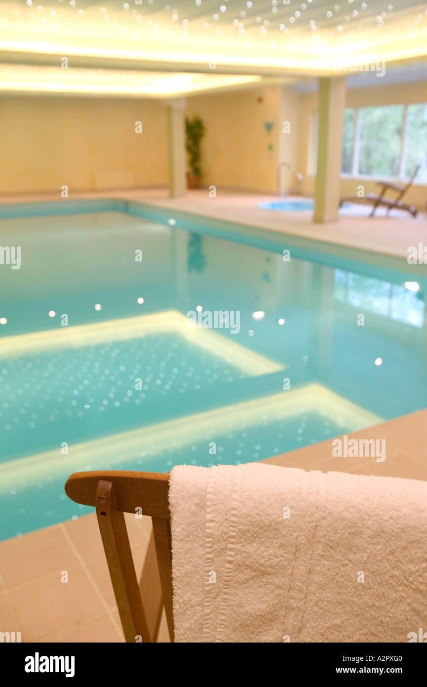 a hotel leisure complex swimming pool in Ambleside, UK, with towel and chair Stock Photo Alamy