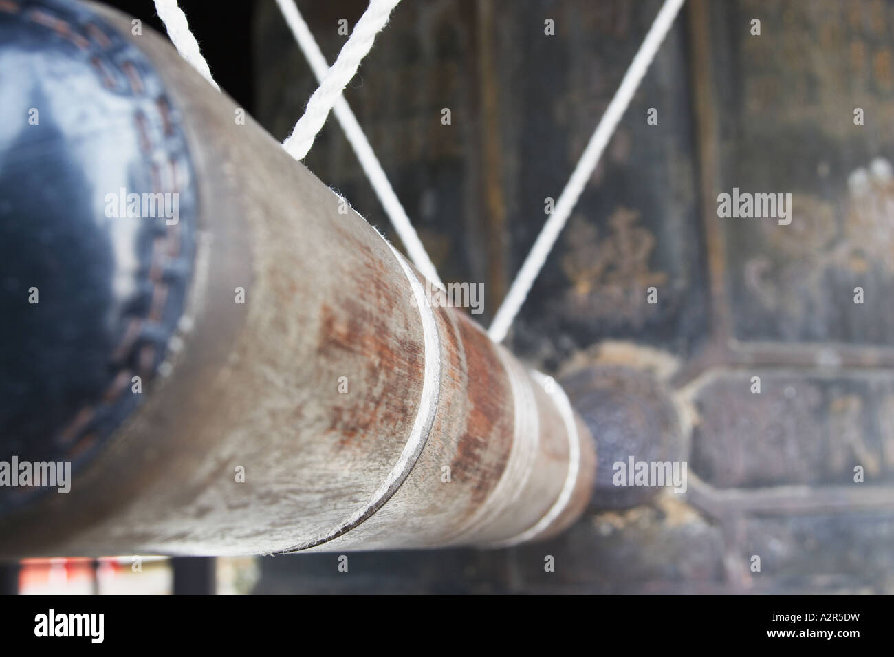 Wooden Pole Used For Striking Ancient Bell Stock Photo