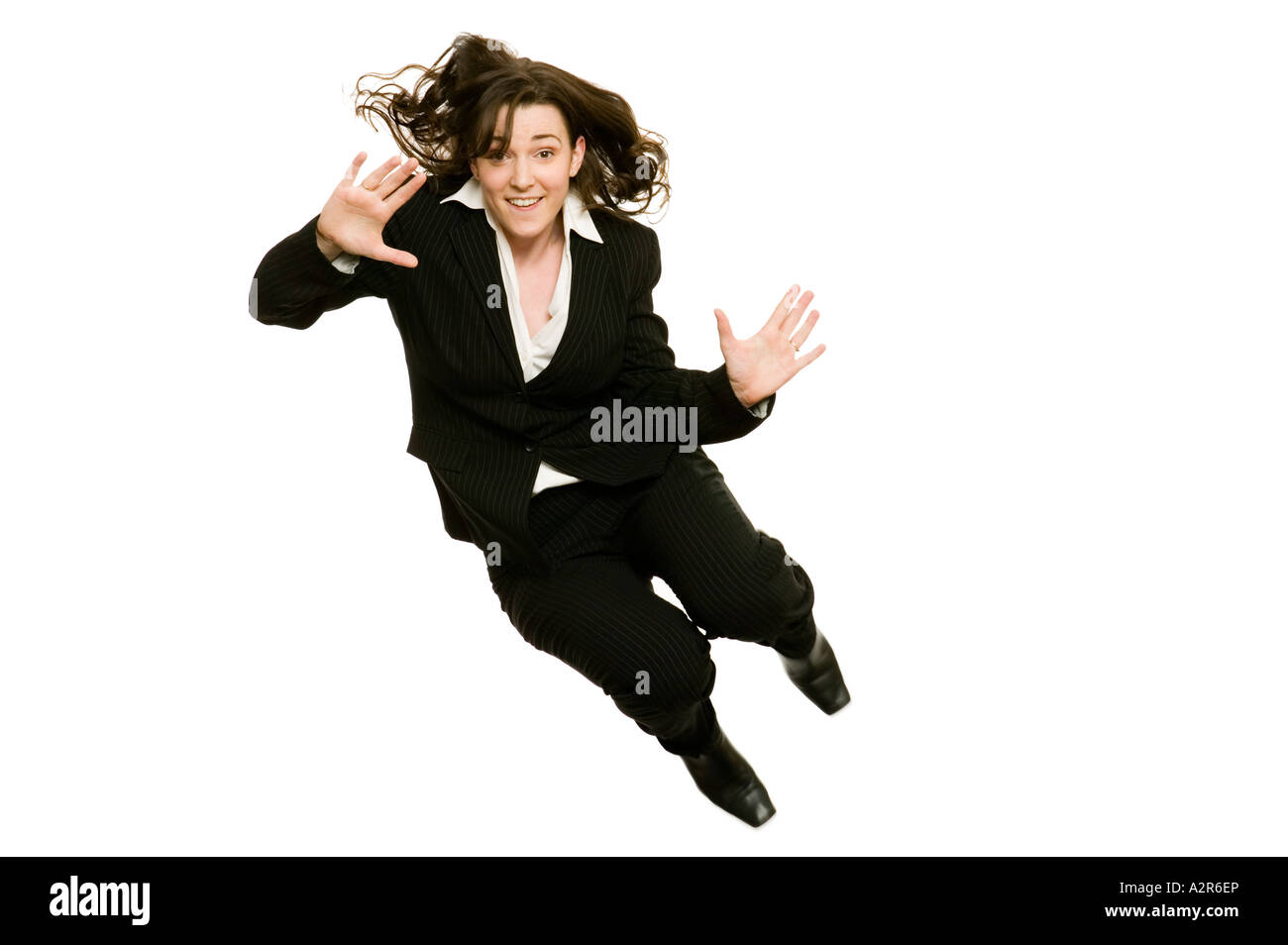 business woman jumping high in the air to celebrate success Stock Photo