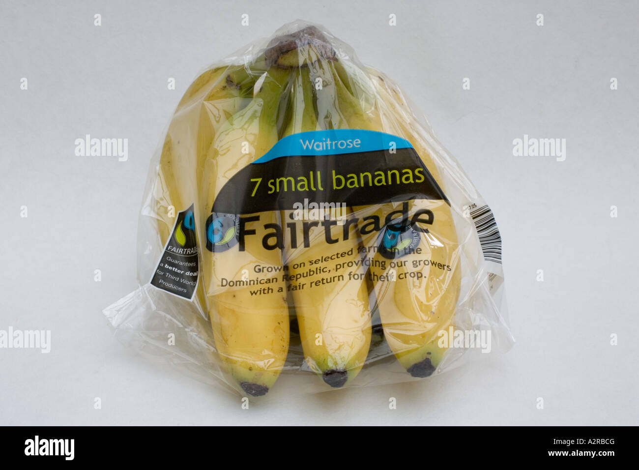 Bunch of wrapped fairtrade Waitrose bananas with FT logo from Dominican