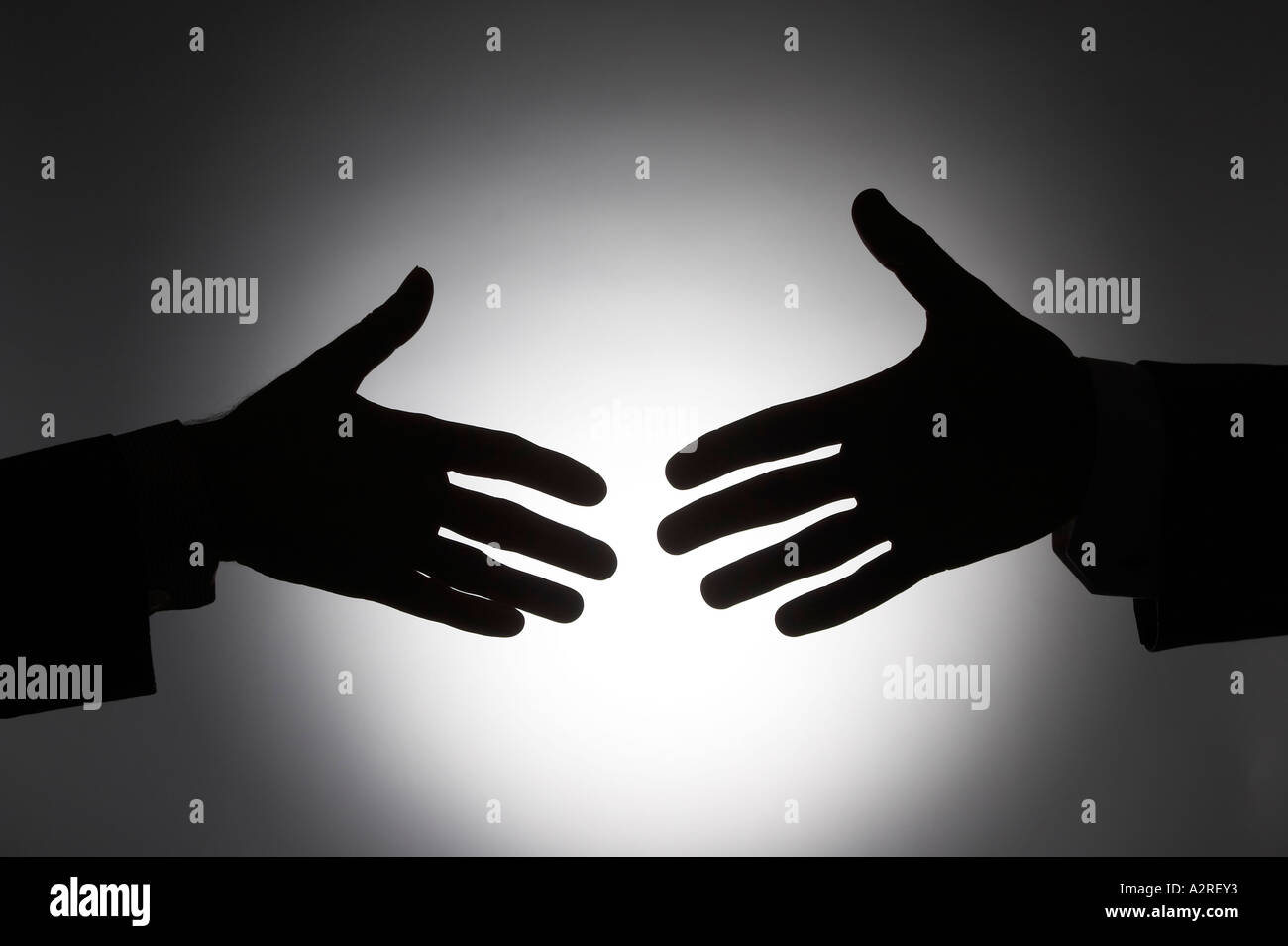 Silhouette of approach of handshake of two corporate business men in ...