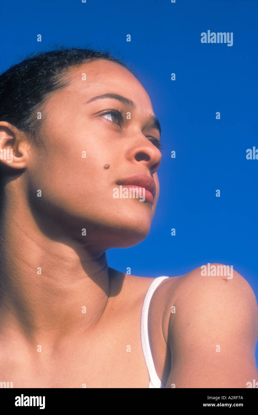 Portrait of mixed Caucasian African American female looking to side Stock Photo