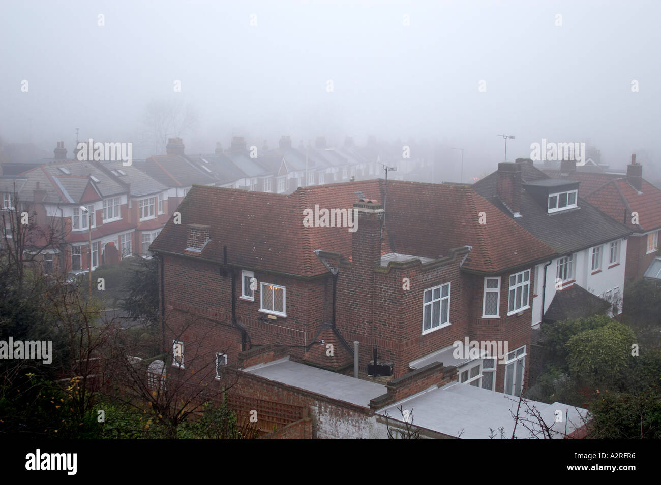 Suburban houses and rooftops of Muswell Hill in mist or fog London N10 Stock Photo