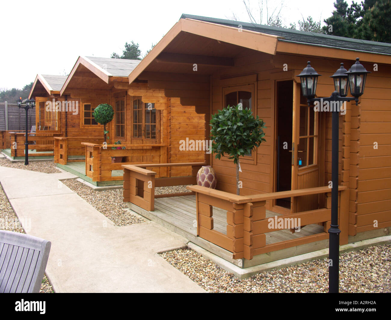 Timber Cabins Sheds On Display In Outdoor Shop Sales Area Stock