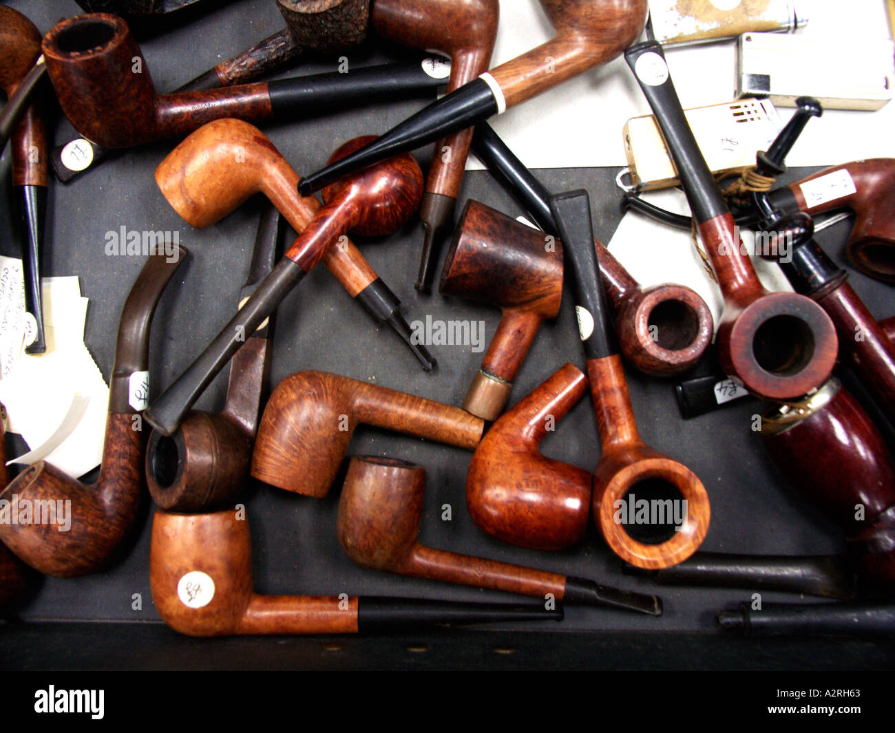 Collection of smoking pipes in a box looking down Stock Photo