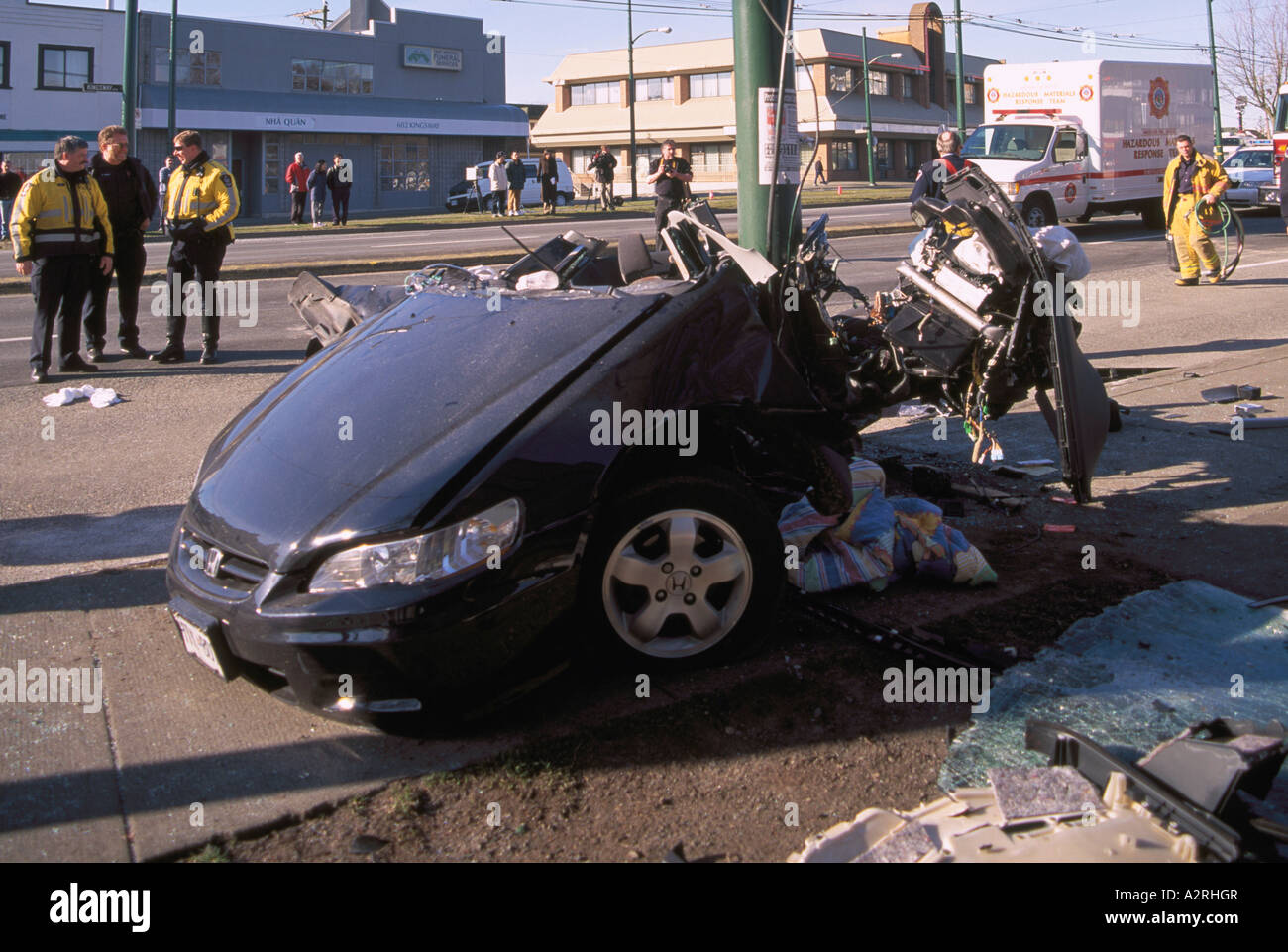 Police investigate Fatal Car Crash Traffic Accident Scene of Speeding Teenage Driver into Pole Vancouver British Columbia Canada Stock Photo