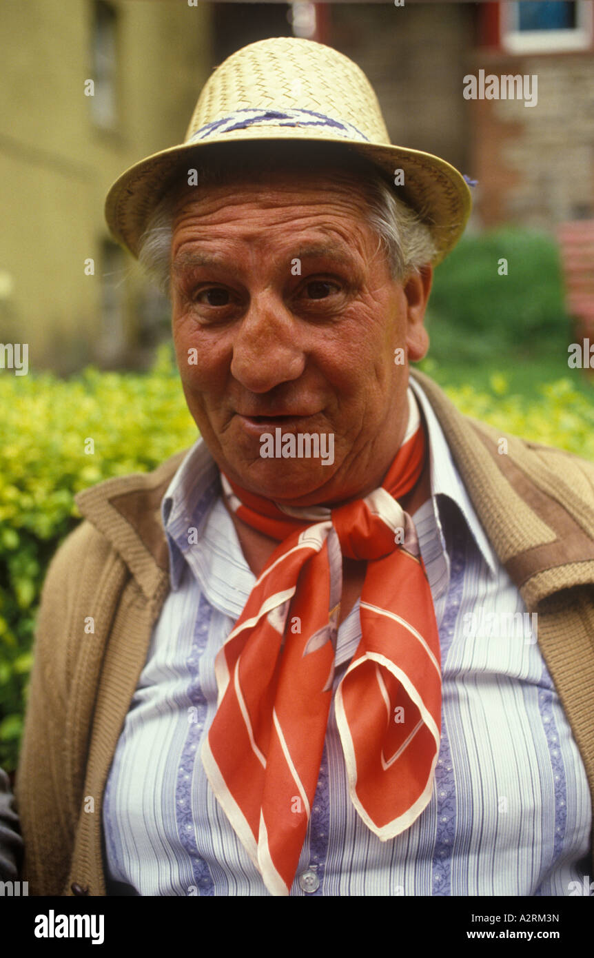 Man with broken nose and ruddy complexion wearing red neckerchief .  UK  1980s 1985 HOMER SYKES Stock Photo