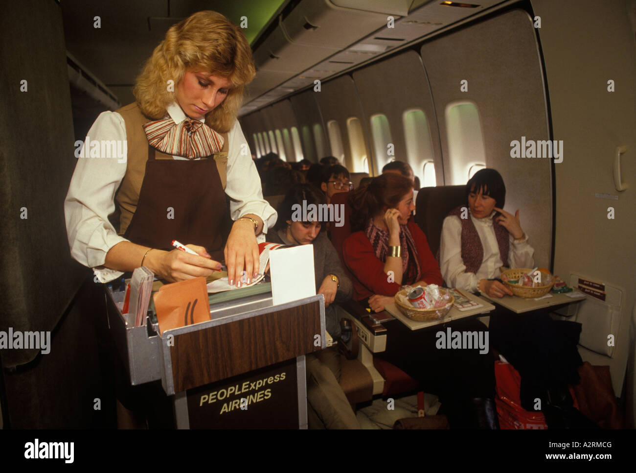 People Express PeopleExpress May 26th 1983 first flight from Gatwick  airport London to Newark New Jersey USA , going on vacation. HOMER SYKES  Stock Photo - Alamy