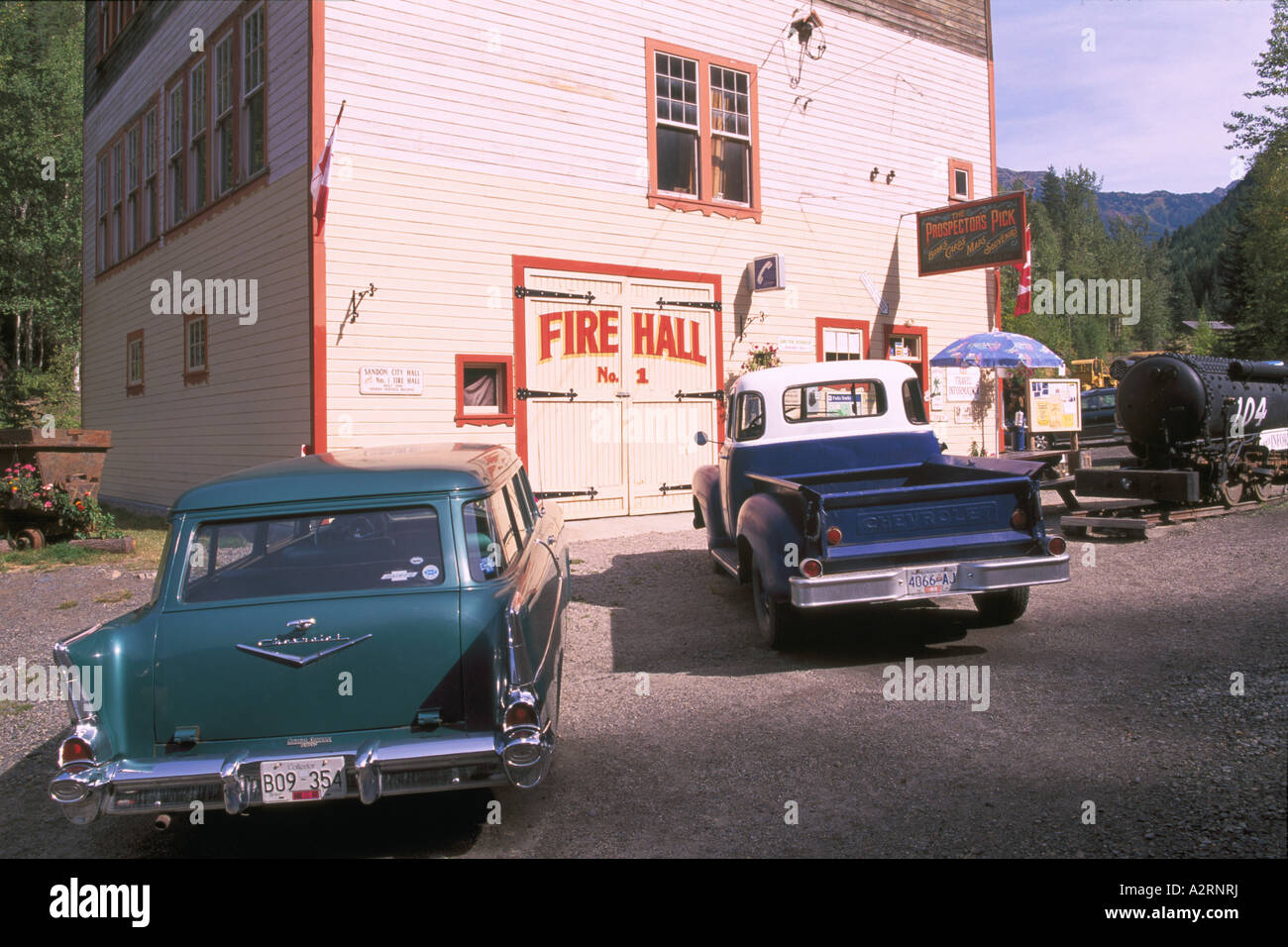 Sandon, BC, British Columbia, Canada - Old City Hall and Classic Cars, Historic 'Silver Rush' Mining Ghost Town, Kootenay Region Stock Photo