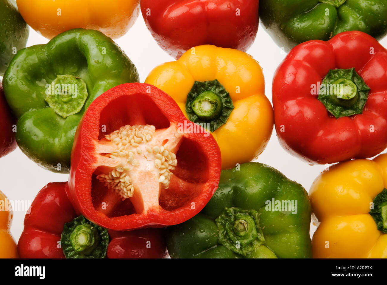 Green yellow and red peppers White background Studio shot Stock Photo ...