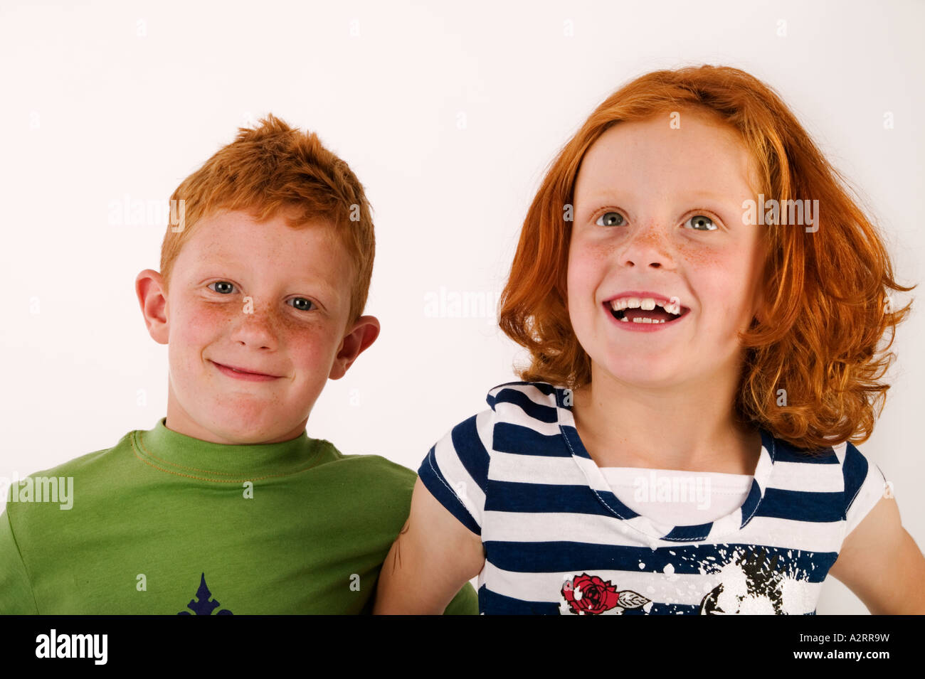 Red haired and freckled twins age7 Studio shot Models Released Stock Photo