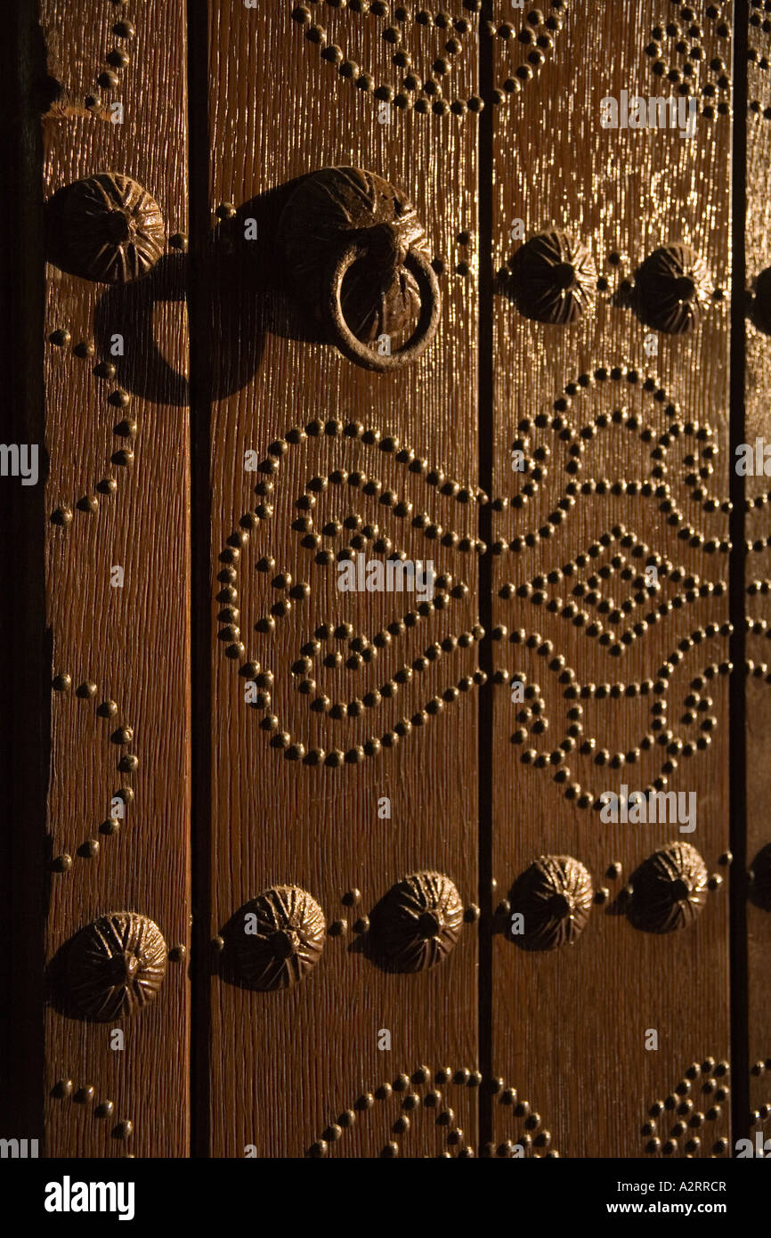 Rustic Rivit old and rustic door wiht khocker wood with metalic rivets making a draw ...
