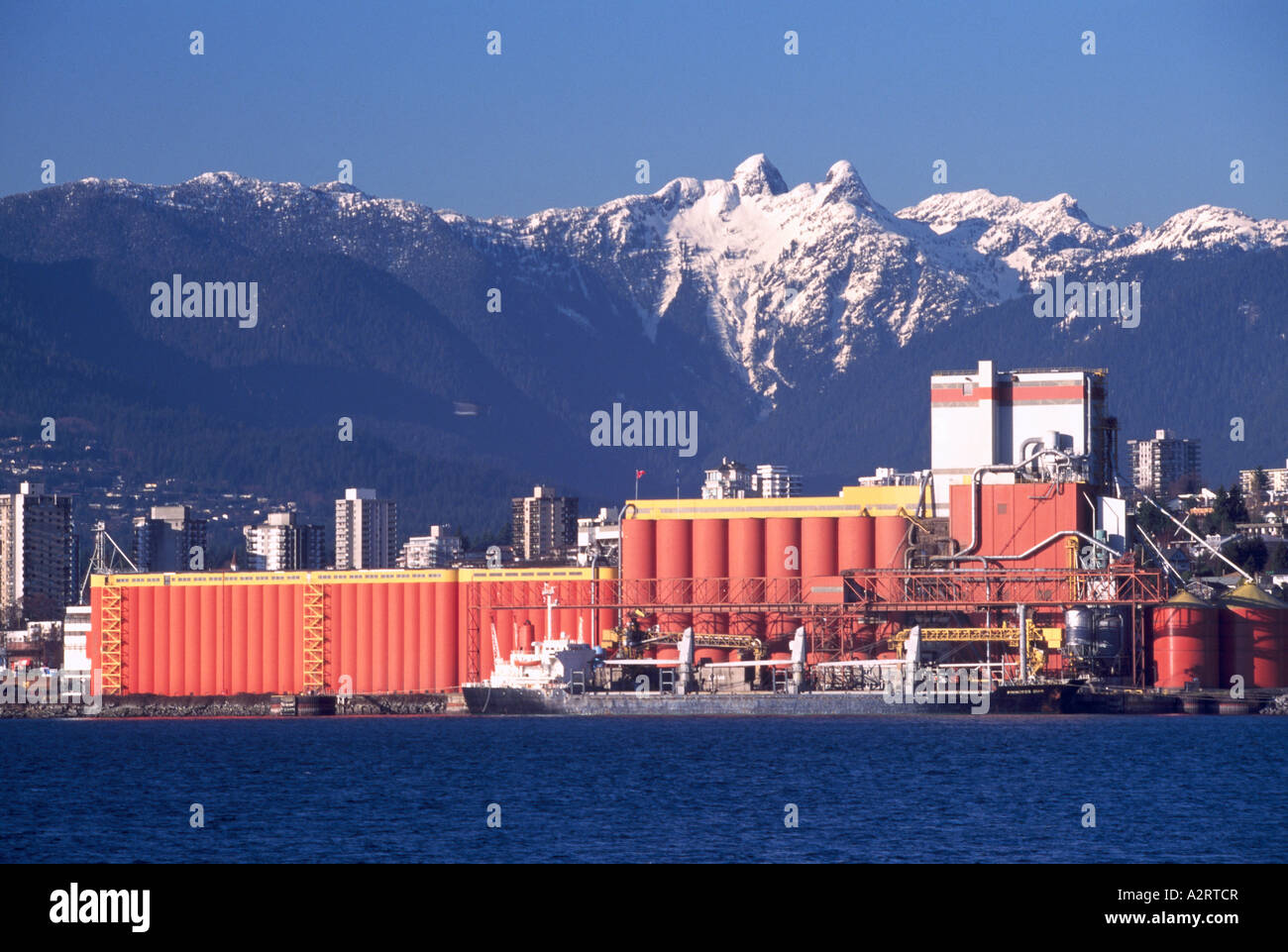 North Vancouver, Port of Vancouver Harbour, BC, British Columbia, Canada - Grain Terminal, Lions Mountain Peaks, Coast Mountains Stock Photo
