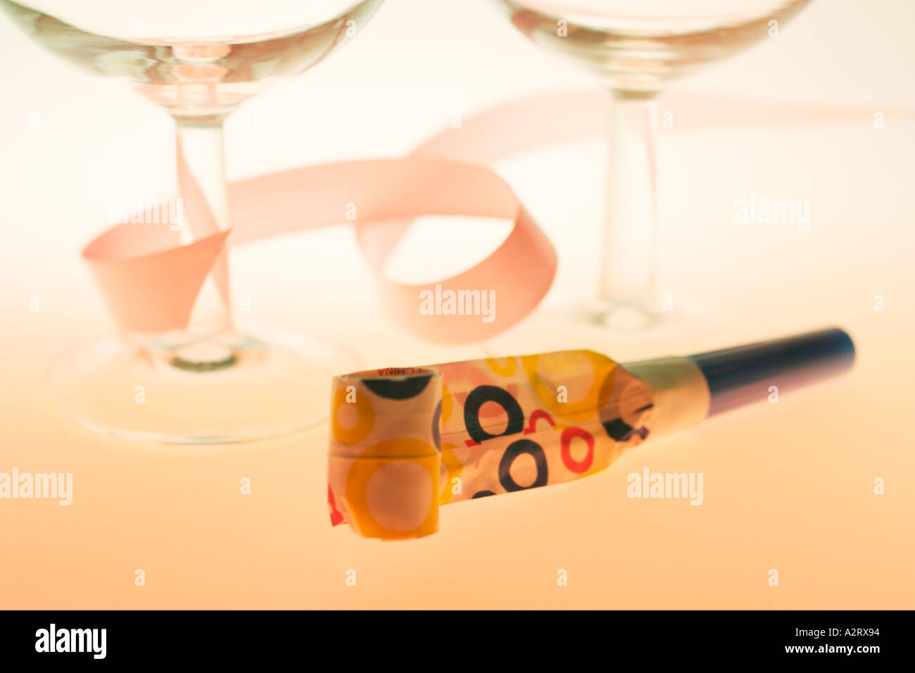 Wine Glasses with Party Blower Stock Photo