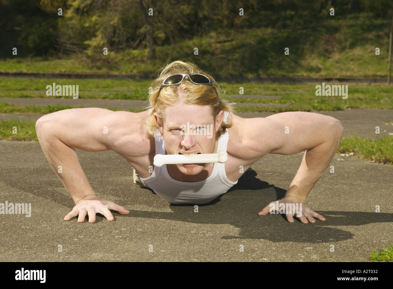 A muscular young man doing push ups Stock Photo - Alamy