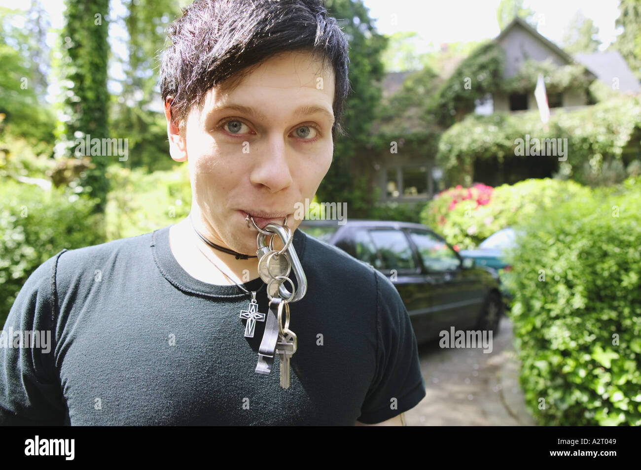 A punky male and his car keys Stock Photo
