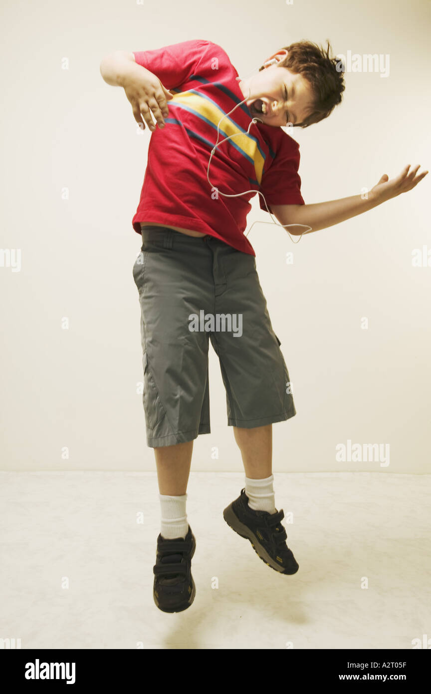 A young boy playing the air guitar Stock Photo