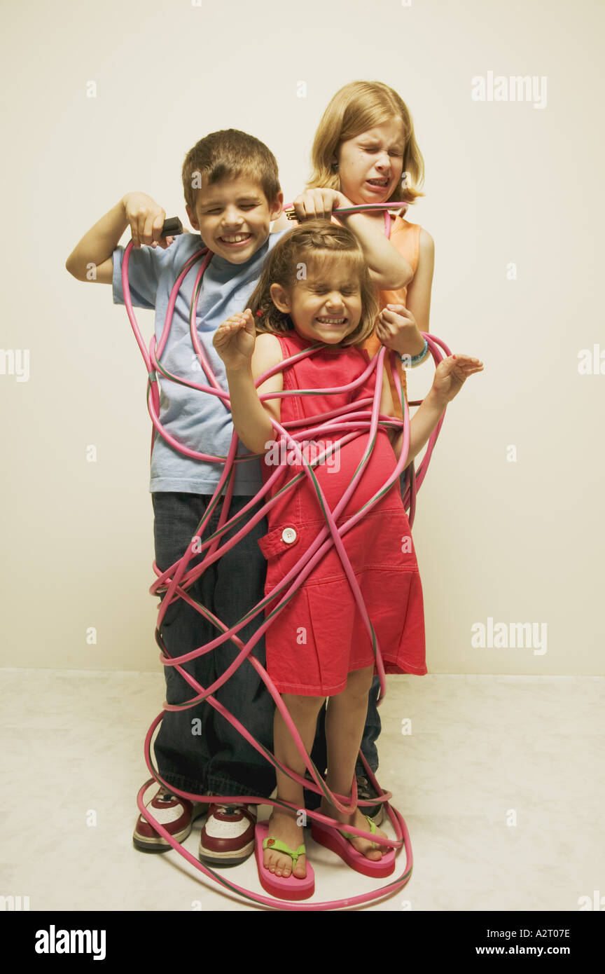 Three totally wired children Stock Photo