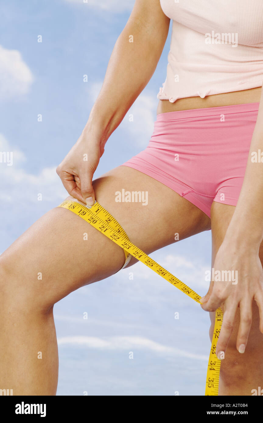 https://c8.alamy.com/comp/A2T0B4/woman-checking-her-thigh-with-a-tape-measure-A2T0B4.jpg